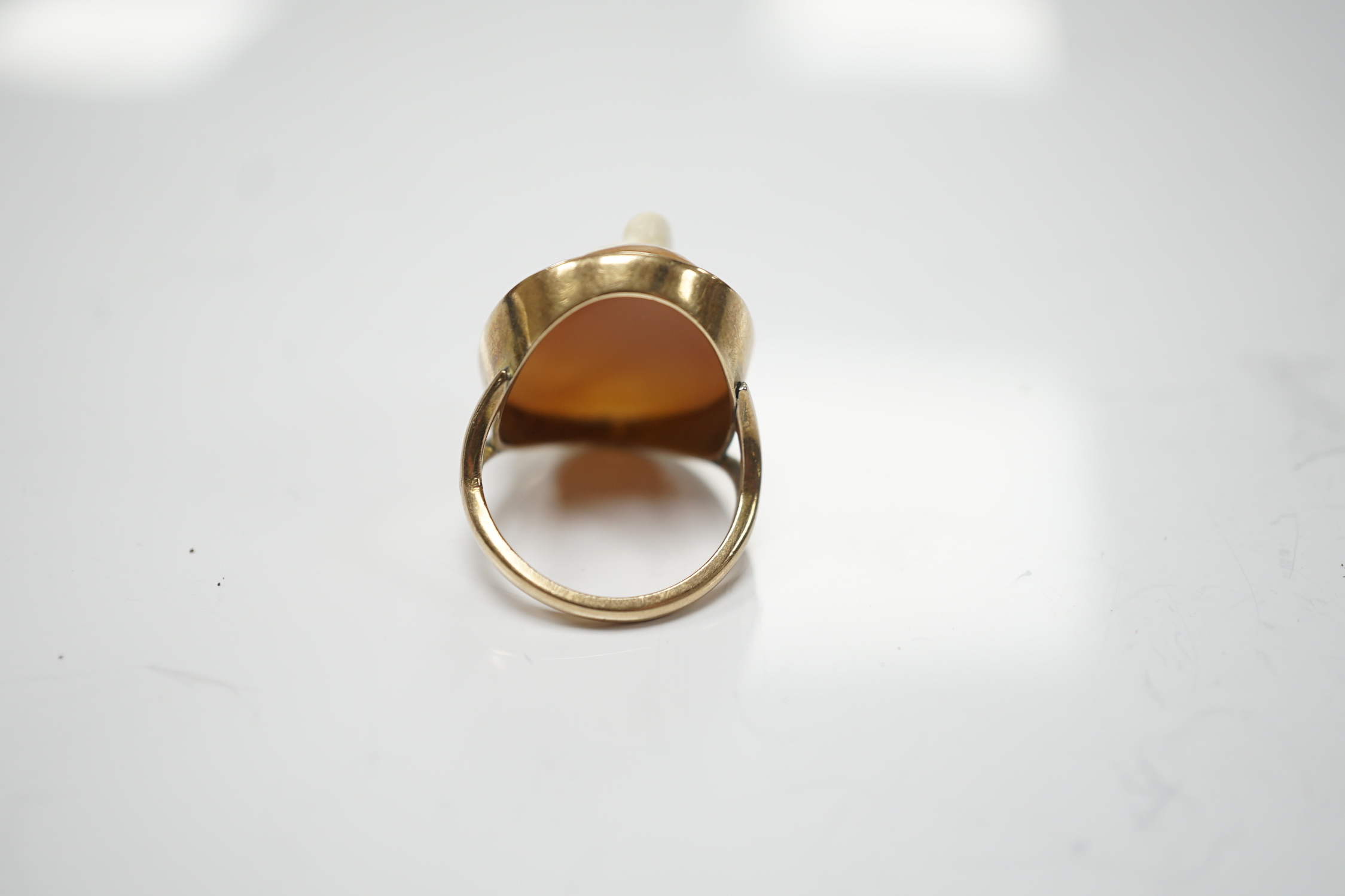 A 9ct and oval cameo shell set ring, carved with the head of Mercury, size O, gross weight 6.6 grams.